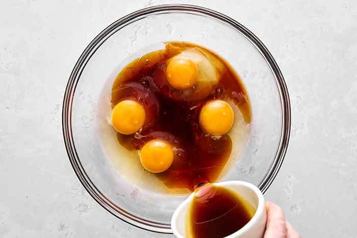 Step two of almond cake: whisk wet ingredients.