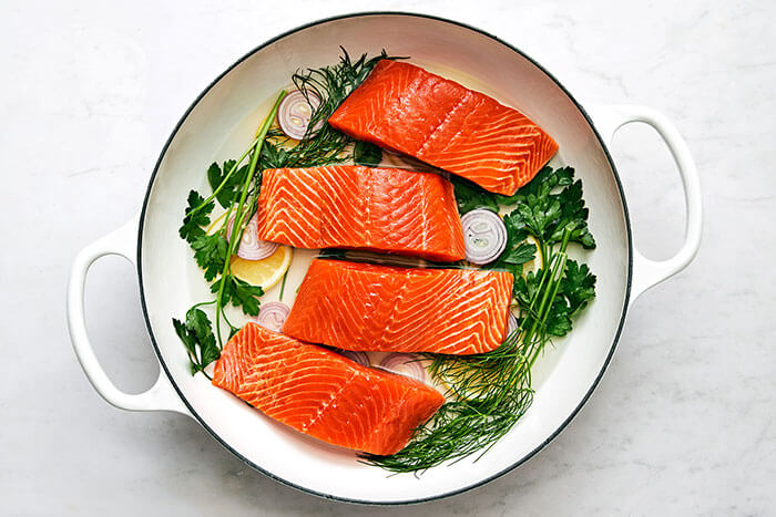 Poaching salmon in pan