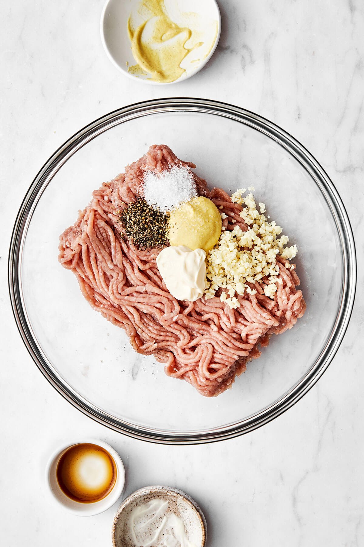 This turkey burger recipe is one you've been looking for all along. The patties are foolproof, perfectly moist, and lend just enough flavor to make the perfect healthy burger. Turkey burger ingredients in a bowl
