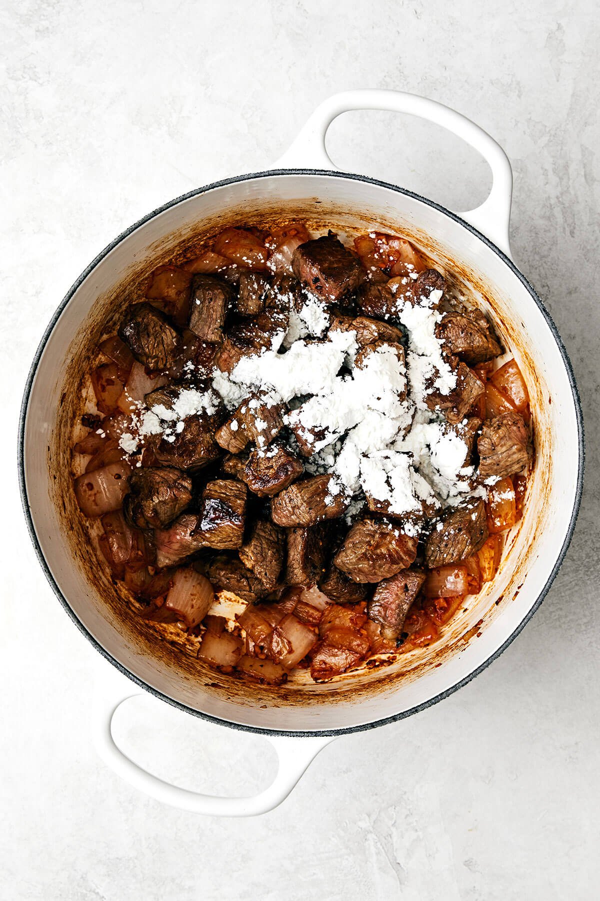 This classic beef stew recipe is a cold-weather one-pot wonder and my favorite for a hearty, comforting, and satisfying meal! Beef stew meat and arrowroot powder in a pot