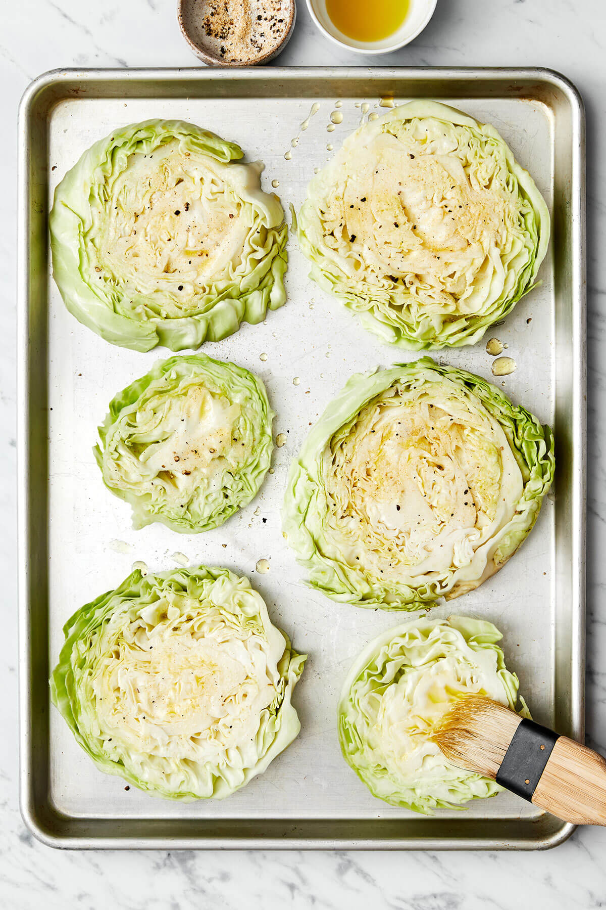 Roasted cabbage steaks are the best way to enjoy this vegetable. They can be served as a side dish or stand-alone meal with various toppings! Brushing oil on cabbage steaks