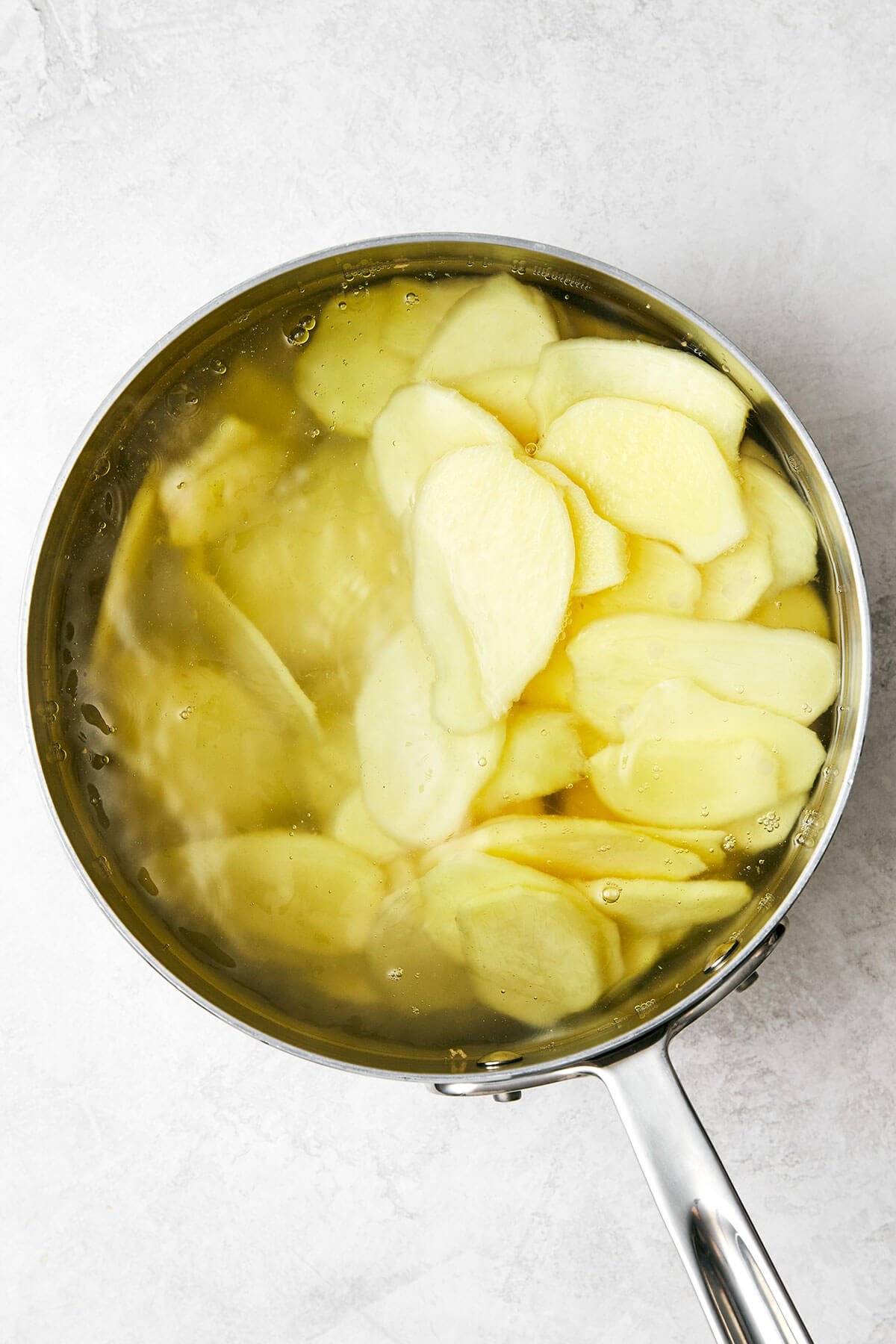 This easy homemade candied ginger is a tasty way to enjoy ginger while reaping all its shining health benefits! Boiling ginger slices in a pot