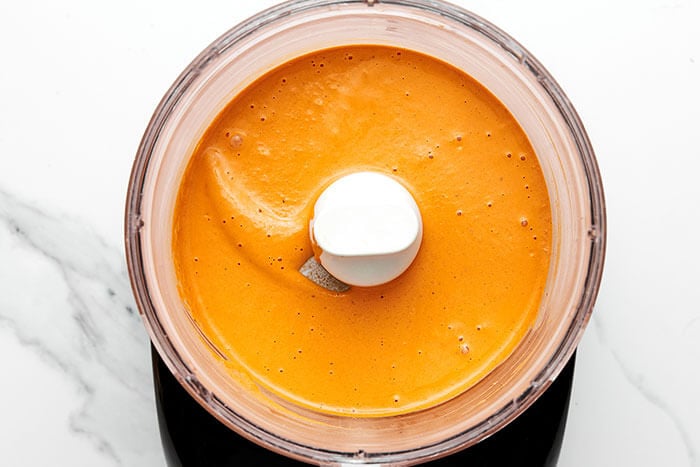 Blending roasted red pepper tahini sauce