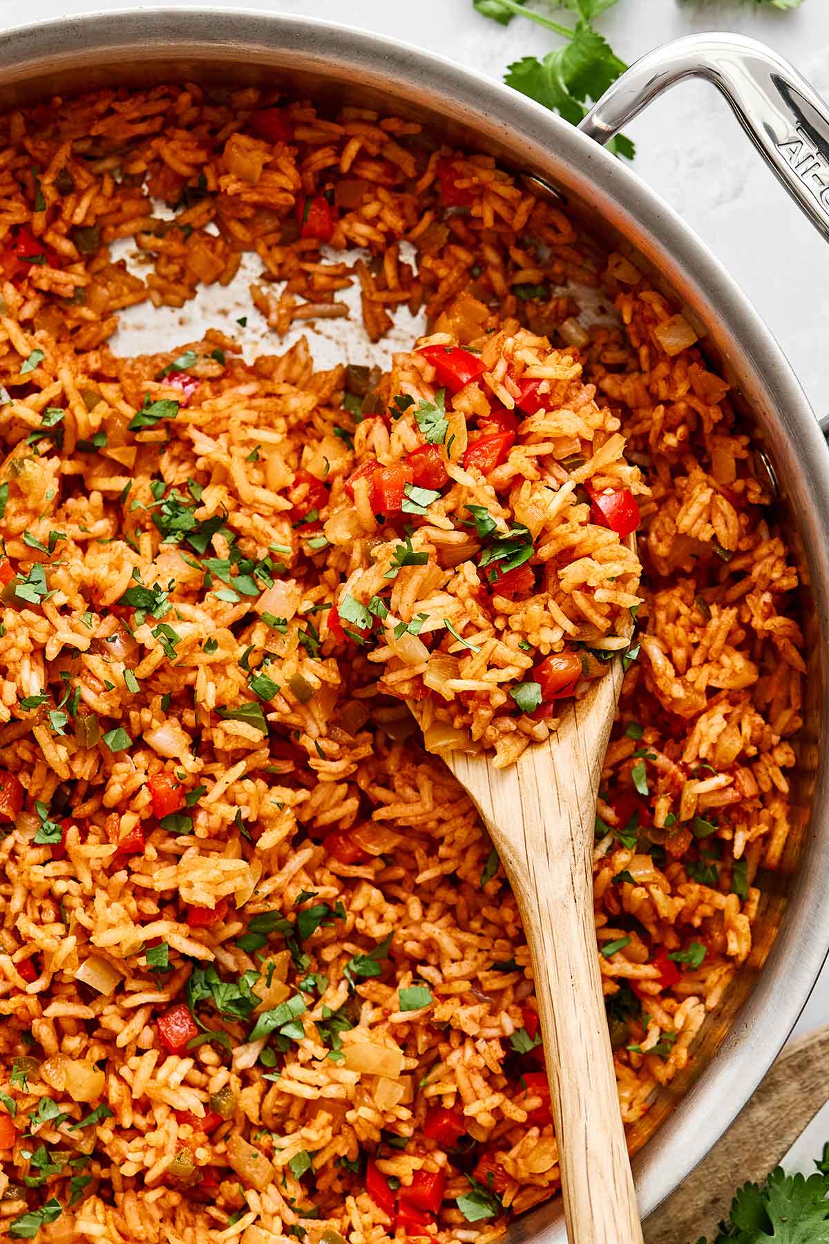 Mexican rice in a pan with a spoon.