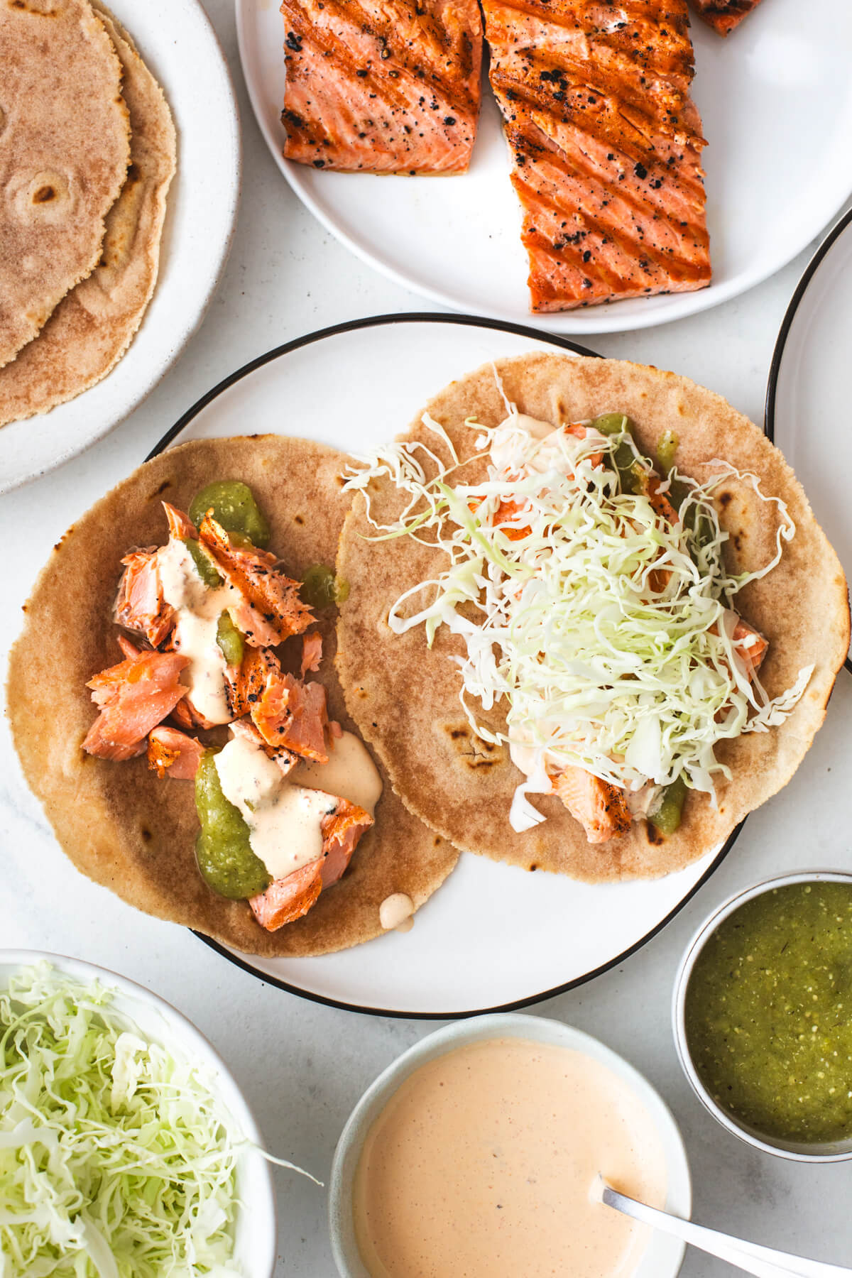 Assembling salmon tacos