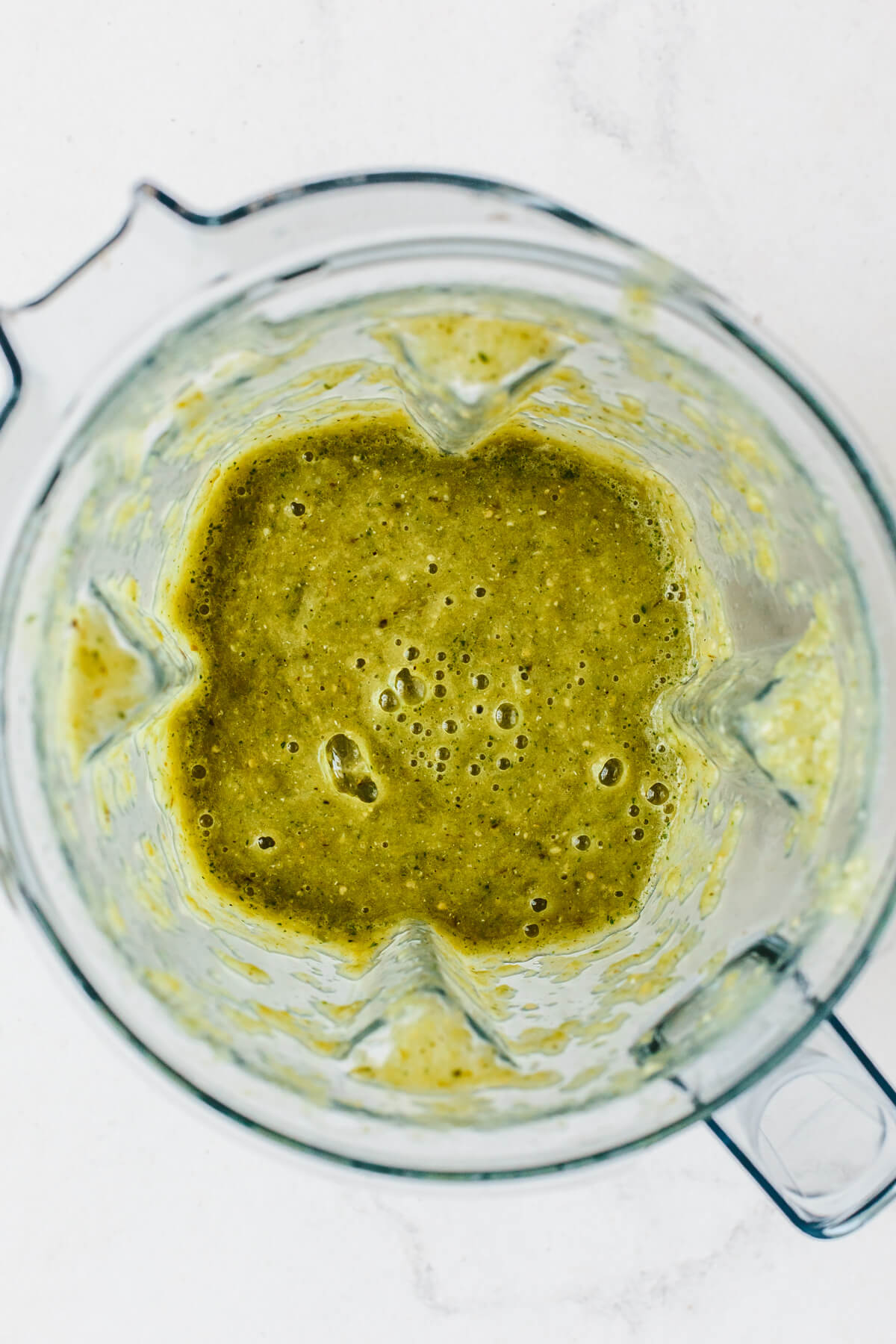 Add a spicy, flavorful kick to any Mexican dish with this homemade salsa verde (tomatillo salsa)! All you need is to roast, blend, and serve. Blended salsa verde