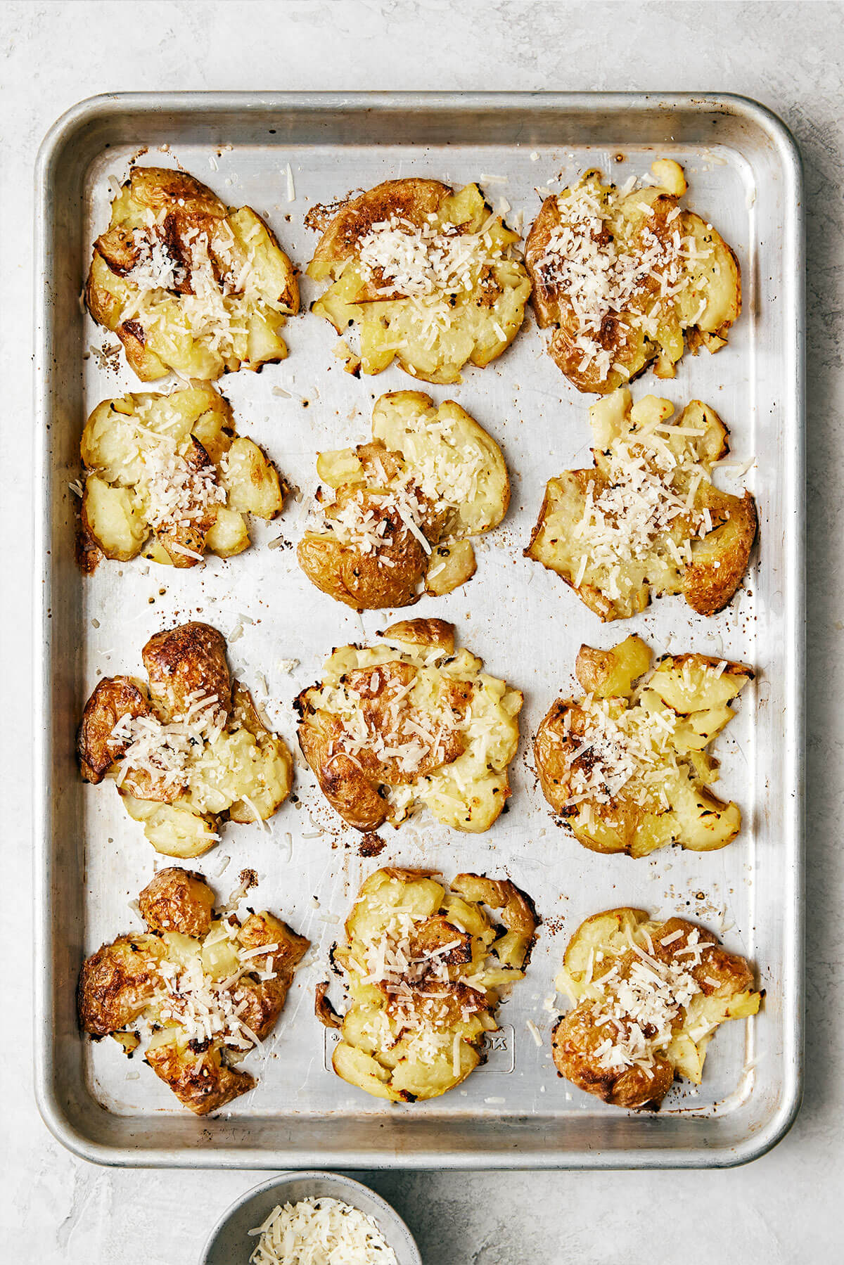Smashed potatoes on a baking tray