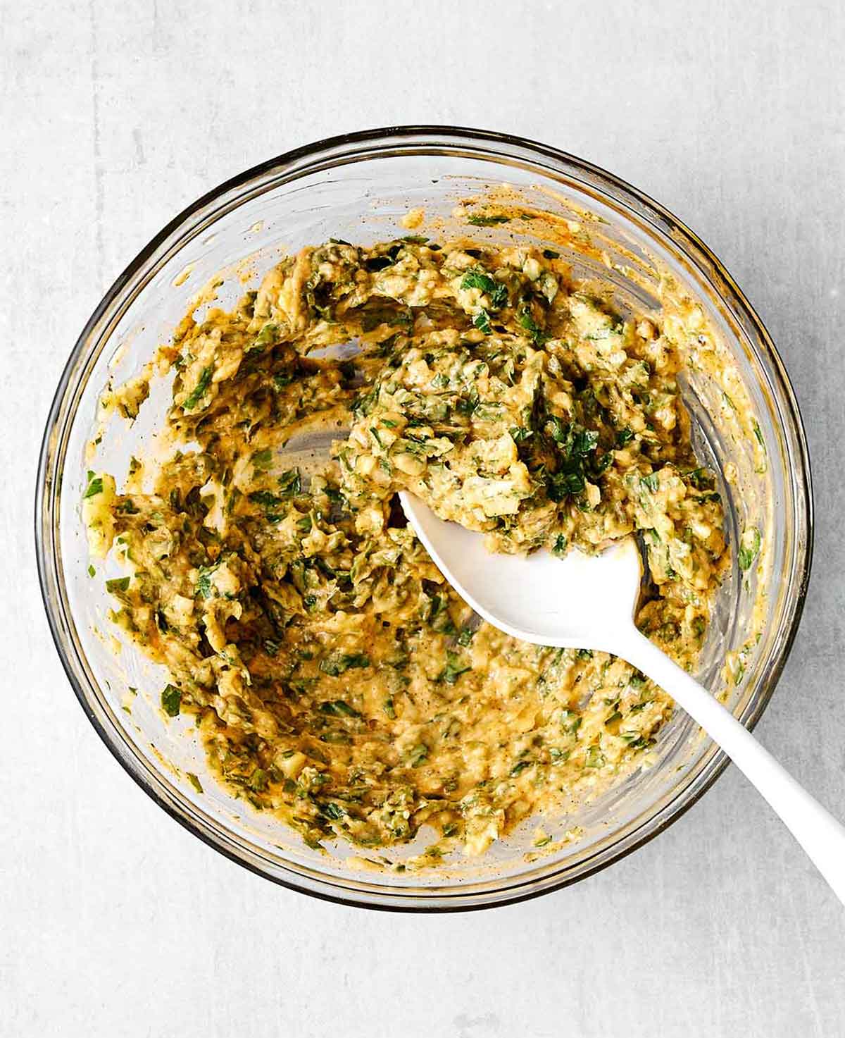 Step two of baked cod: mix the her butter mixture.