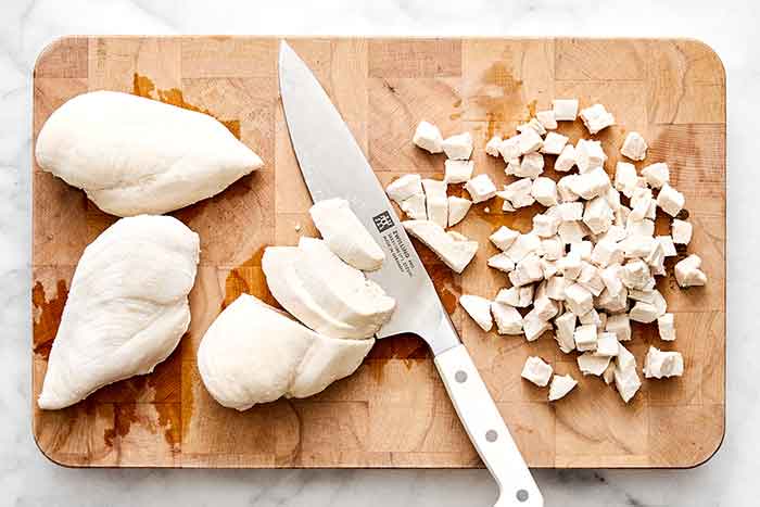 Step three of chicken salad: dice chicken.