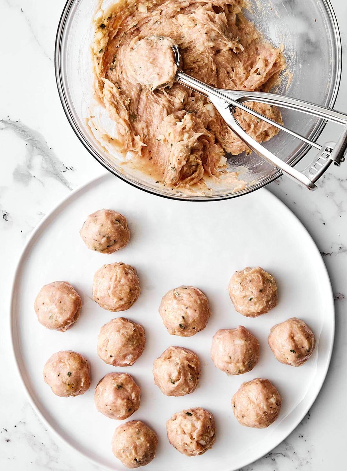 Rolling turkey meatballs.