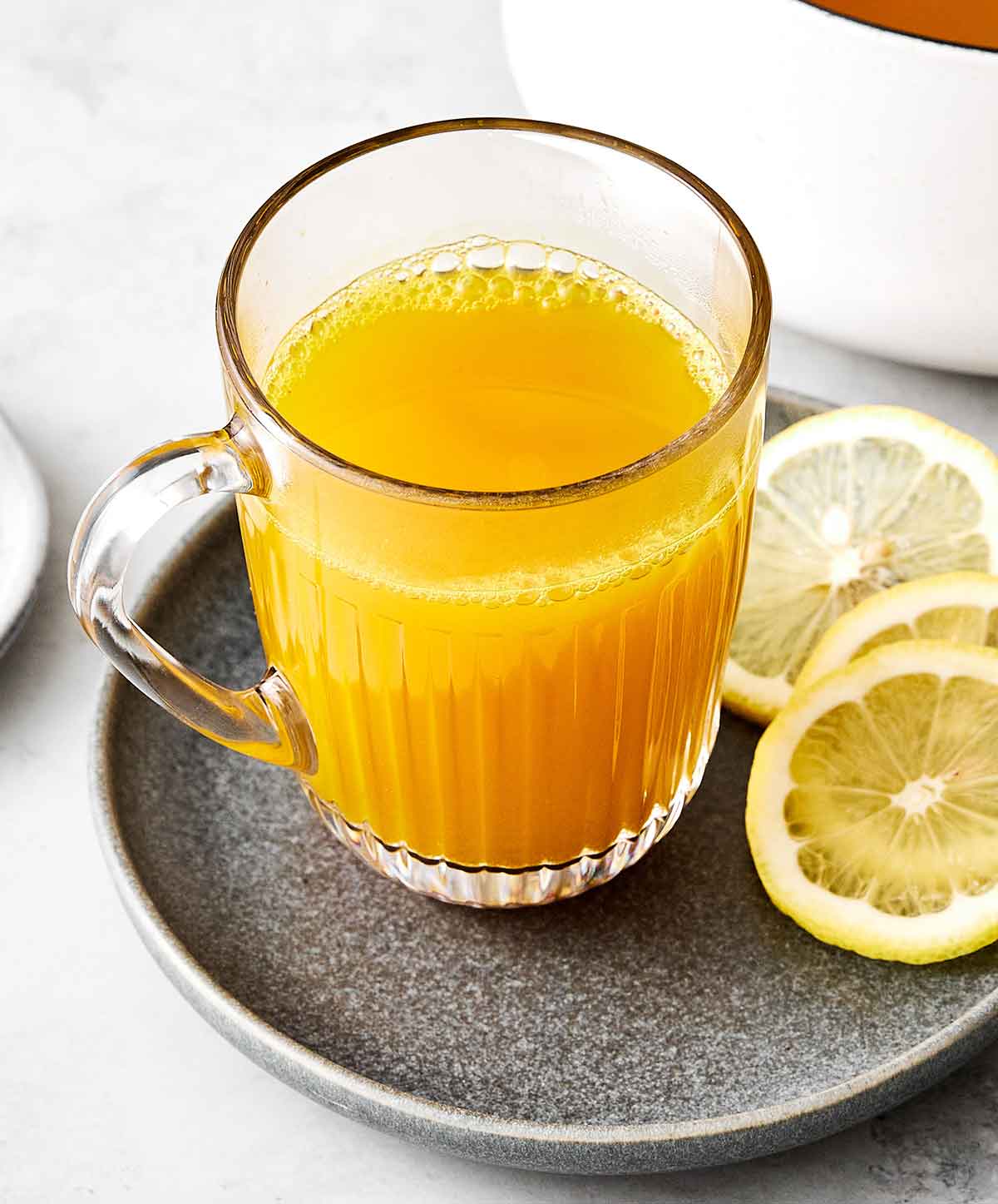 Turmeric tea with lemon slices.