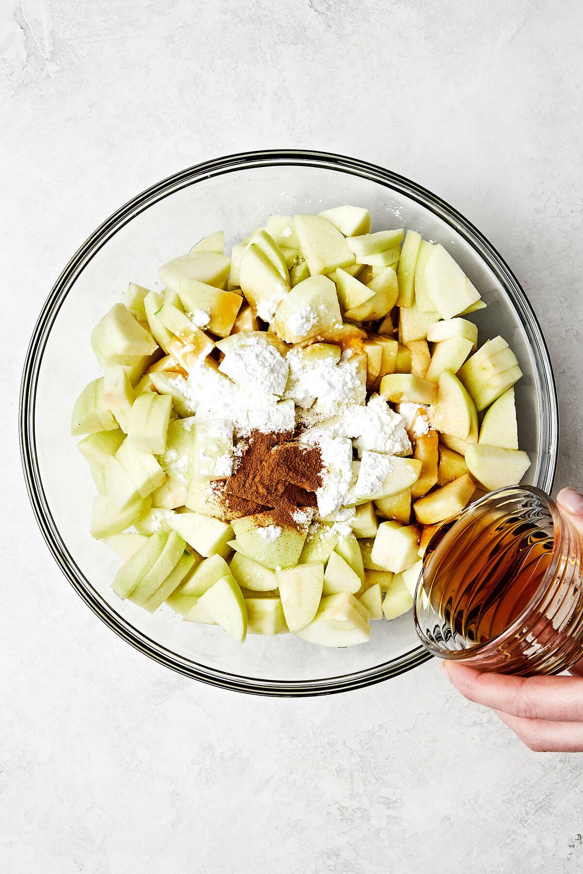 This apple crisp is the best holiday dessert with a sweet cinnamon apple filling and oat crumble topping — especially during Thanksgiving! Mixing apples with a sweet cinnamon glaze.