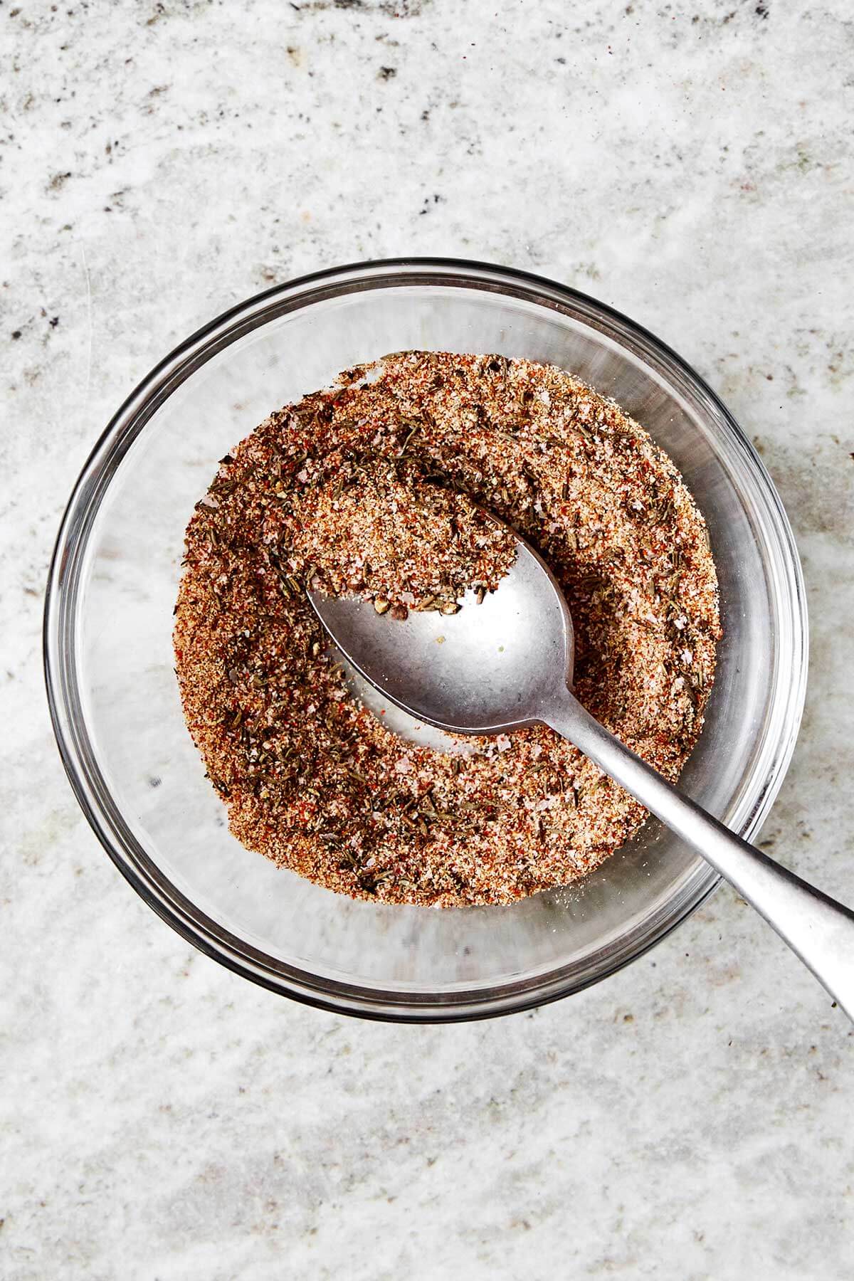 The juiciest pork tenderloin that's seasoned with a flavorful spice blend, seared to a golden crust, and baked with the best honey garlic sauce. Spice rub in a bowl.
