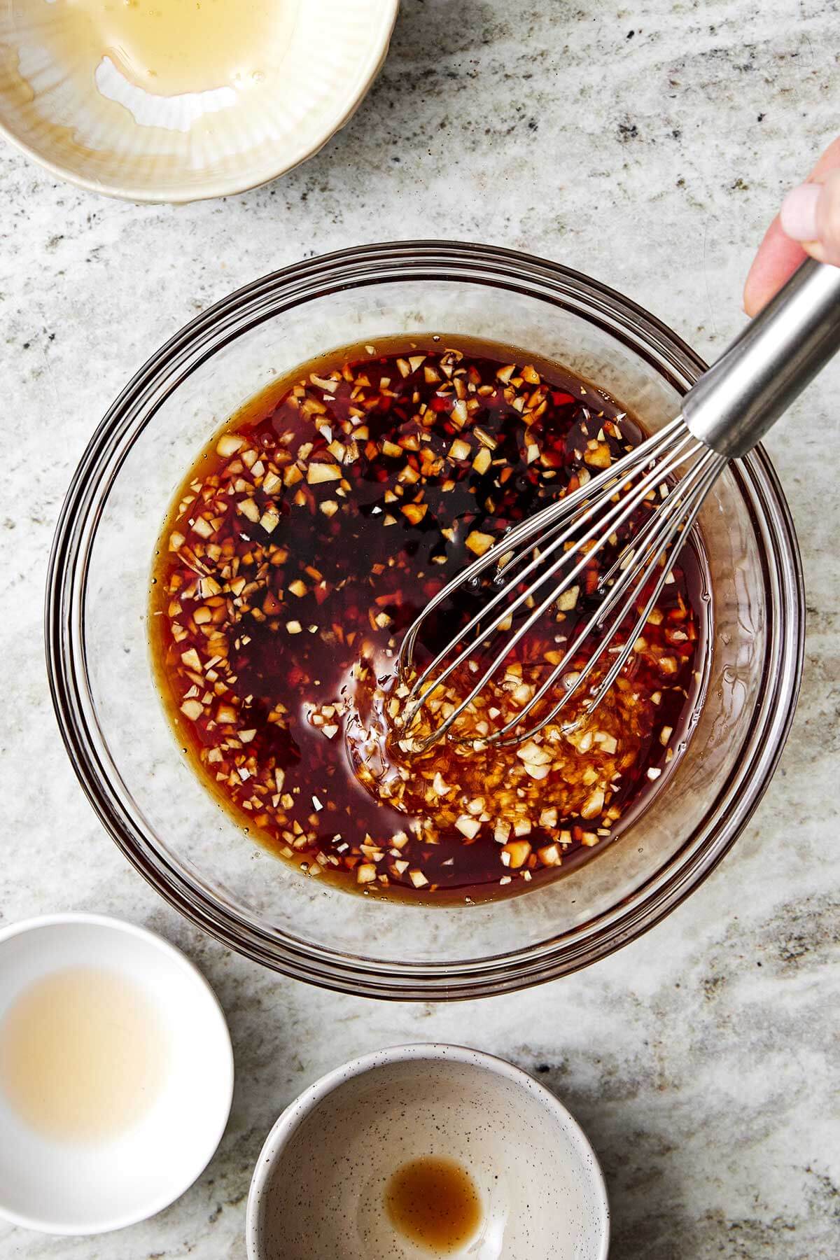 The juiciest pork tenderloin that's seasoned with a flavorful spice blend, seared to a golden crust, and baked with the best honey garlic sauce. The sauce in a bowl for pork tenderloin.