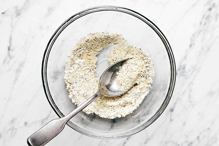Mixing lemon pepper seasoning.