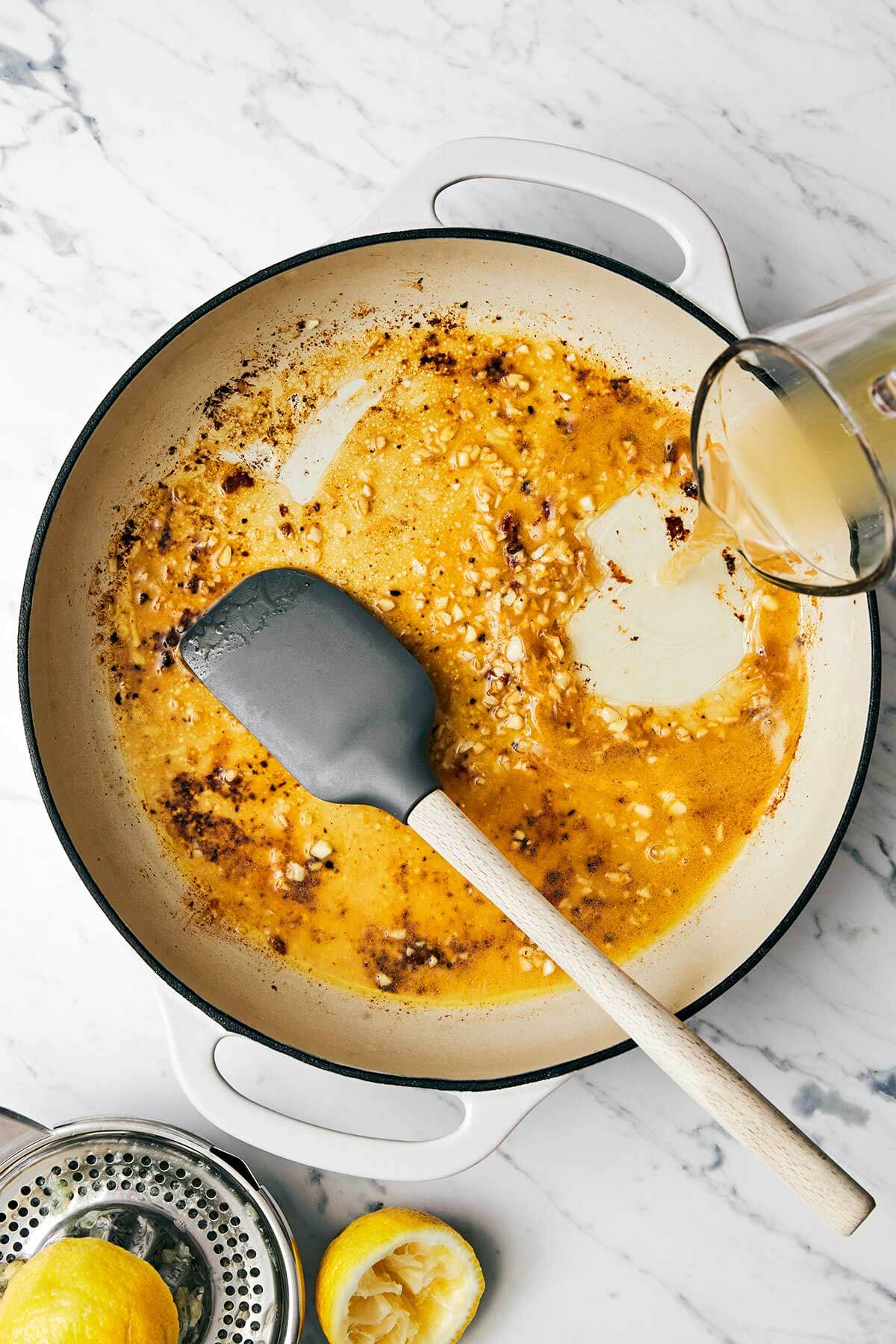 Making garlic butter sauce in a pan.