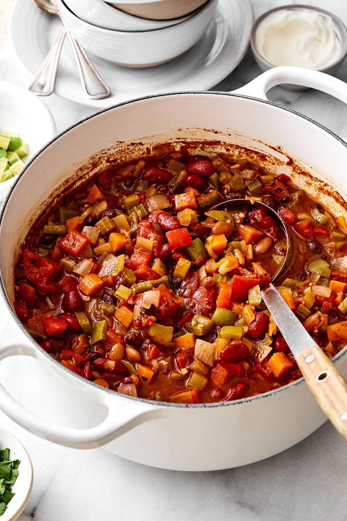This vegetarian chili is a top-notch meatless dinner with layers of good-for-you vegetables, hearty beans, and warming spices! A big pot of vegetarian chili.