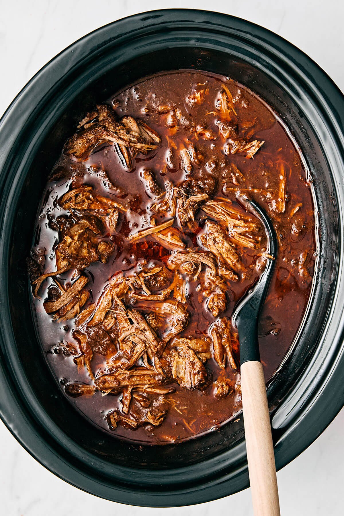 Mexican birria de res is a hearty slow-cooked stew with the utmost flavor and juicy, tender beef. Serve it as is or make birria tacos! Beef birria in a slow cooker.