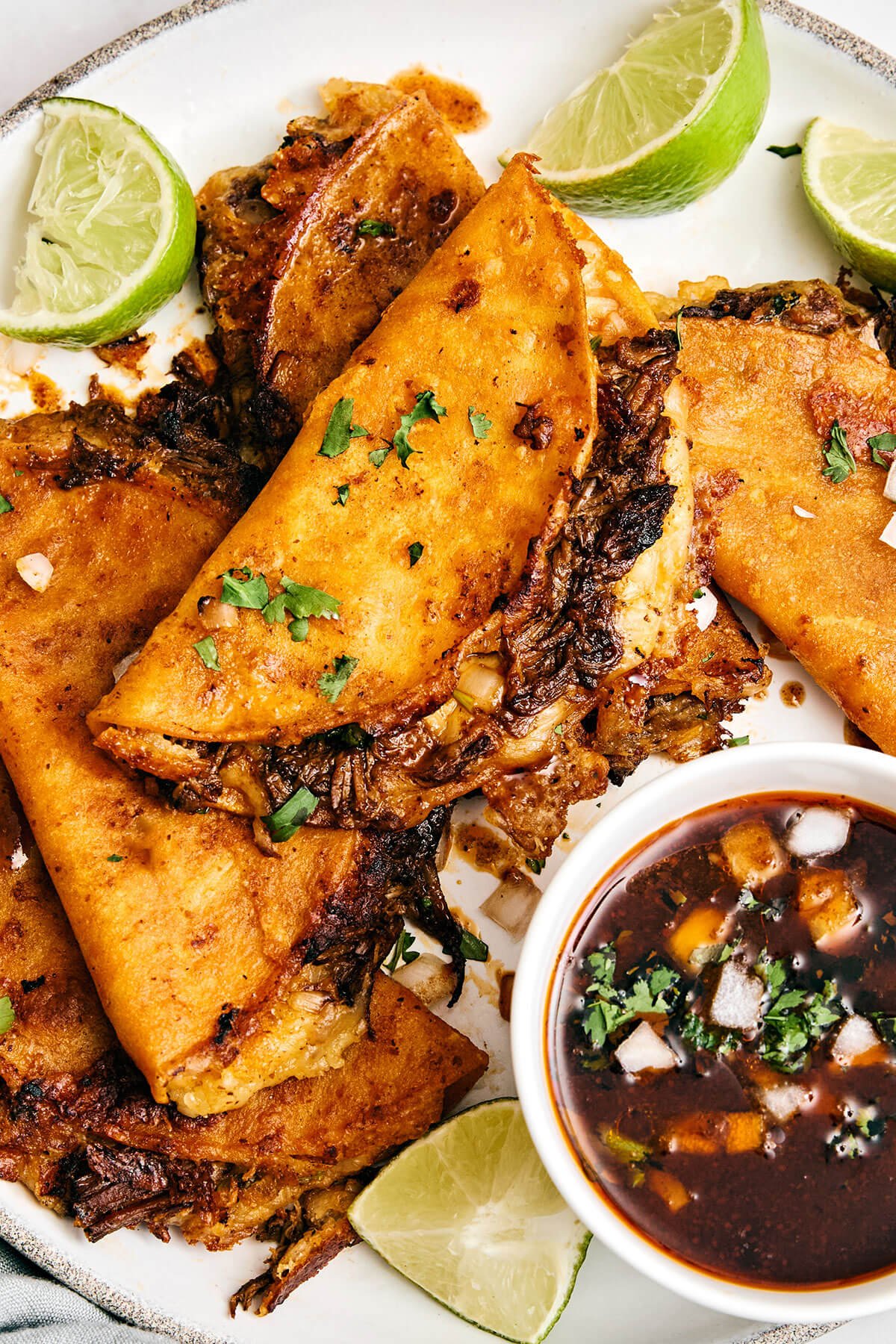 Mexican birria de res is a hearty slow-cooked stew with the utmost flavor and juicy, tender beef. Serve it as is or make birria tacos! Beef birria tacos.