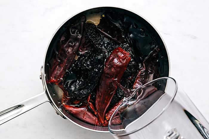 A pot boiling Mexican chiles.