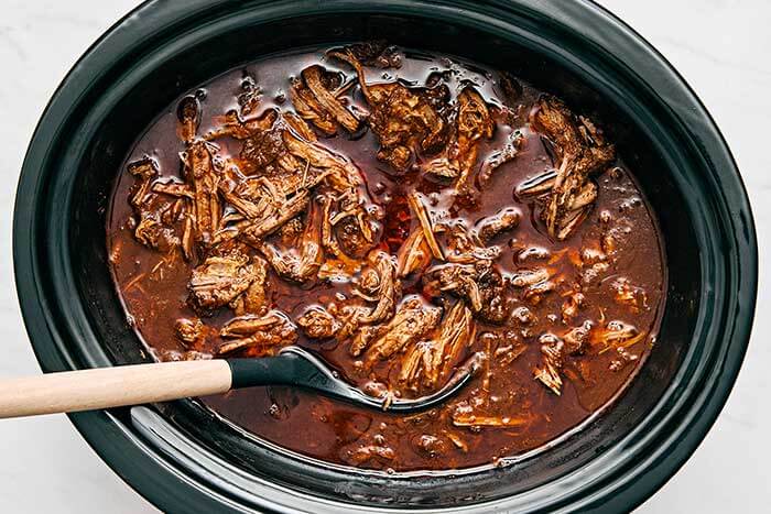 Beef birria in a crockpot.