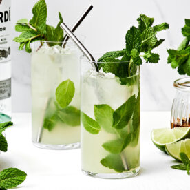 Two glasses of mojito with mint leaves.