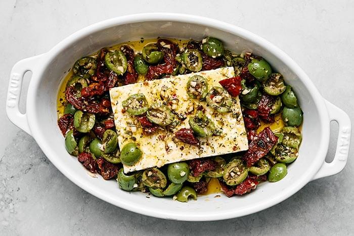 A baking dish with baked feta.