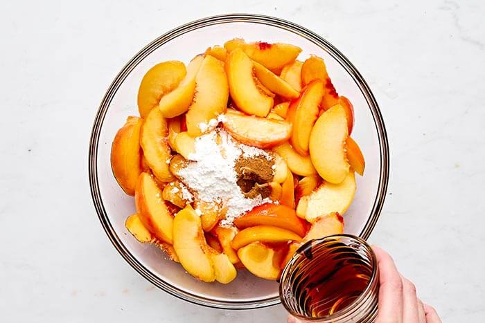 Making peach crisp filling.