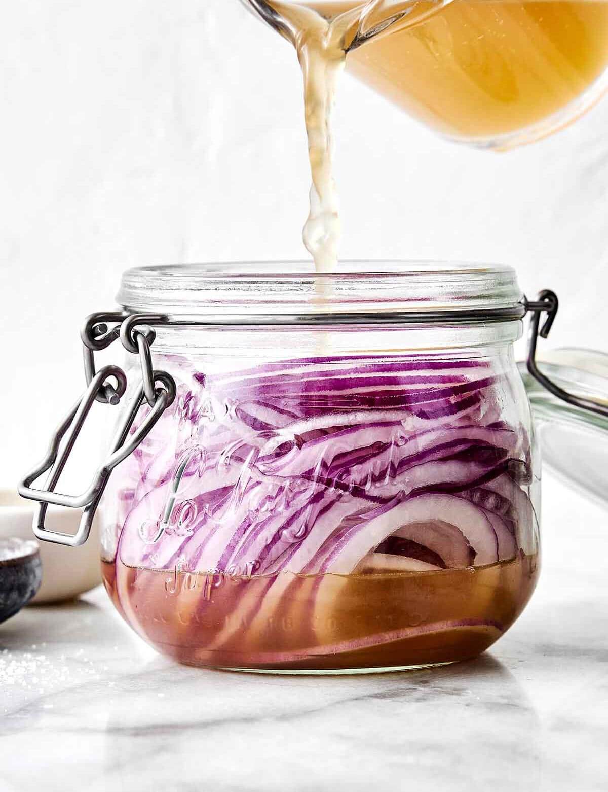 Making quick pickled onions in a jar.