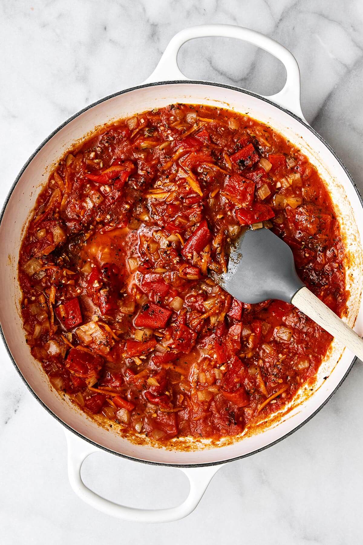 Cooking tomato sauce in a pan.