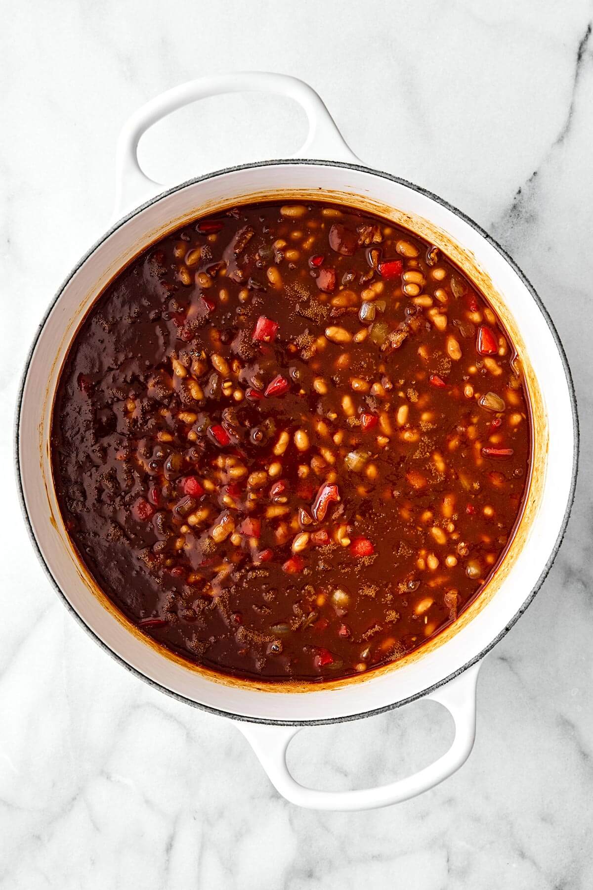 Cooking baked beans in a pot.