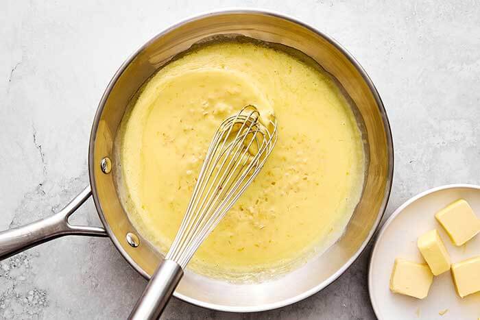 Cooking beurre blan in a pan.