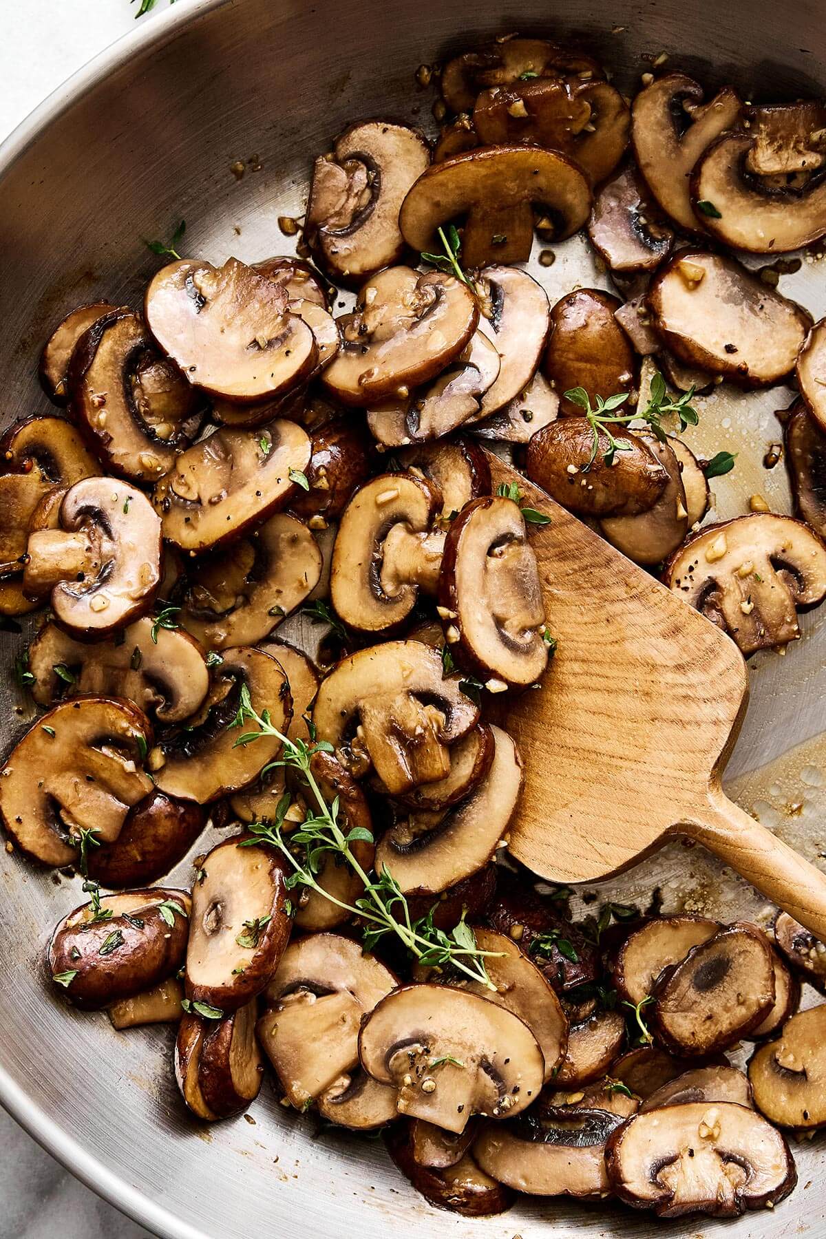 Sautéed mushrooms are the simplest way to add a buttery umami flavor to any meal — especially with steak, burgers, and more! A pan with sauteed mushrooms.