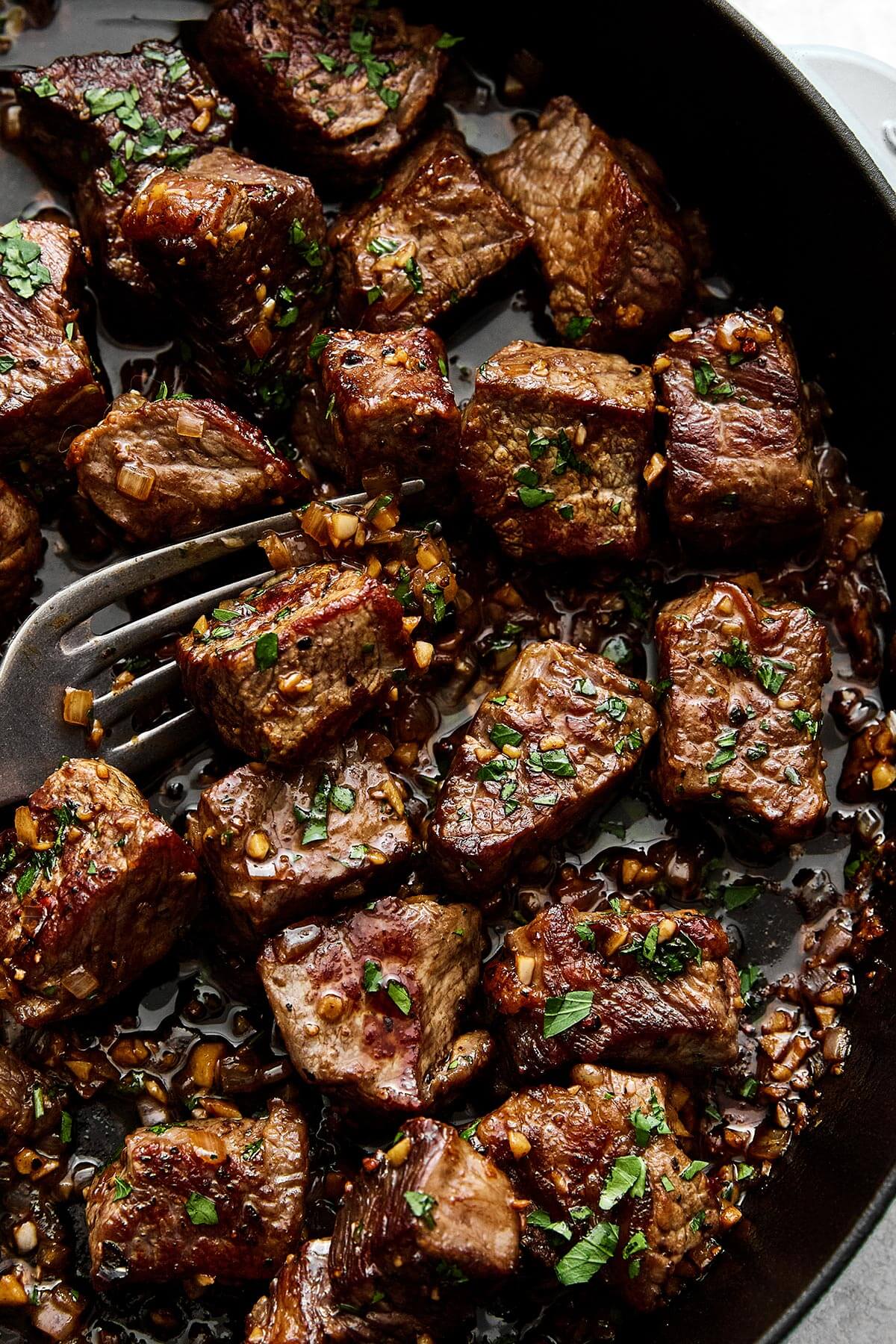 Garlic butter steak bites with a fork.