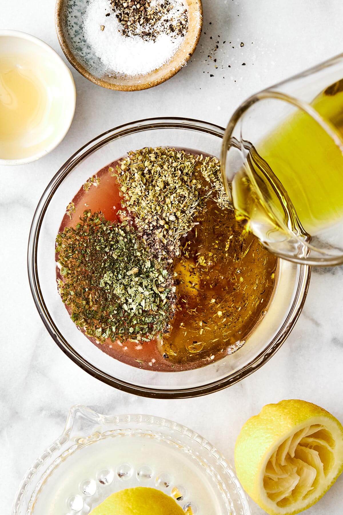 Making Italian dressing in a bowl.