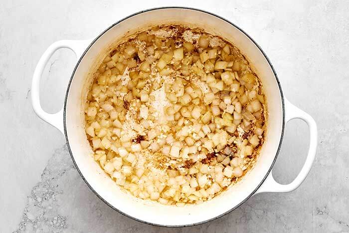 Cooked onions in a pot.