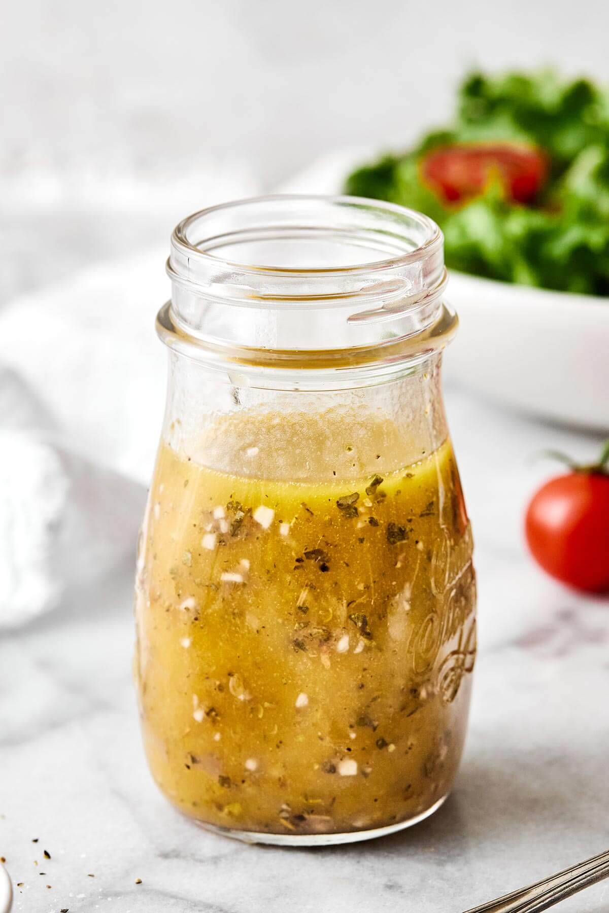 A bottle of homemade Italian dressing.