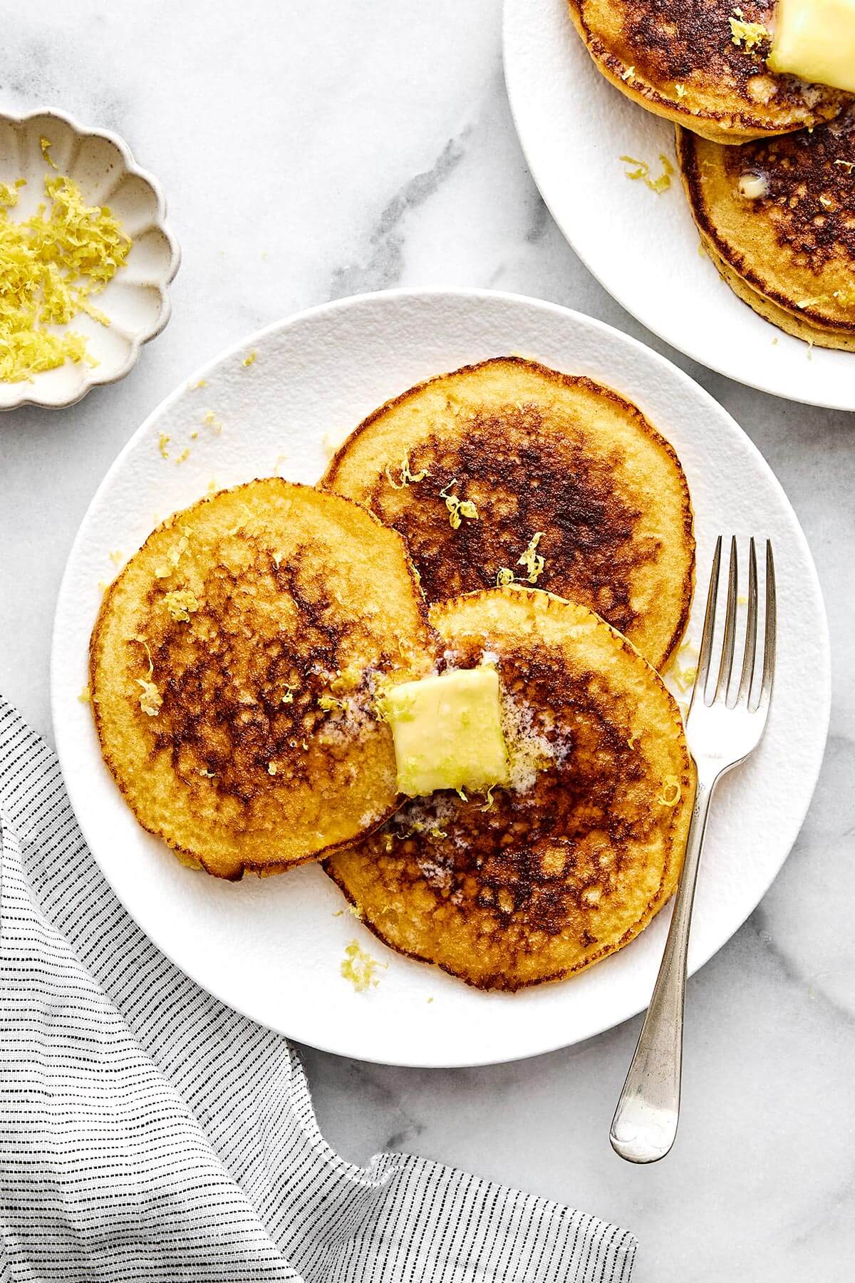 Lemon ricotta protein pancakes on a plate.