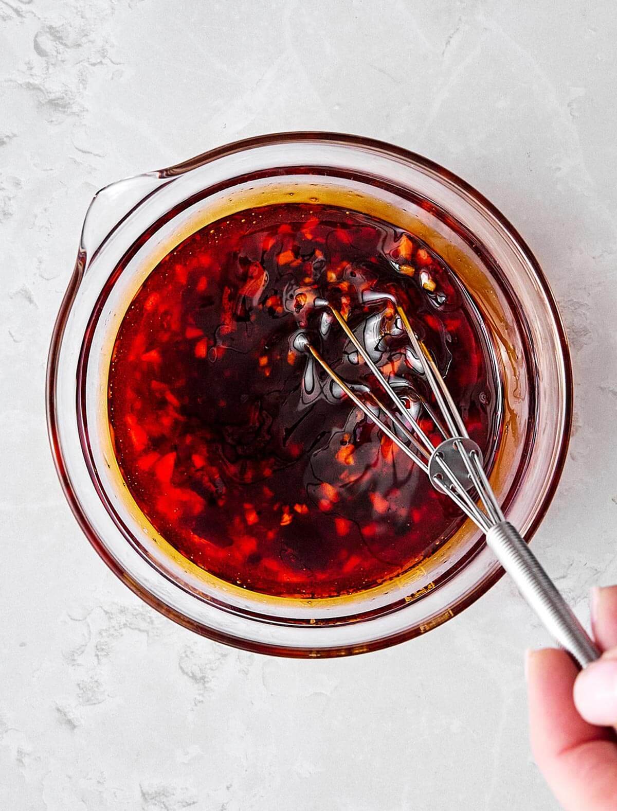 Fresh, crunchy, and packed with flavor, this Asian cucumber salad is the perfect side dish for Asian-inspired dinners! Whisking Asian cucumber salad dressing.