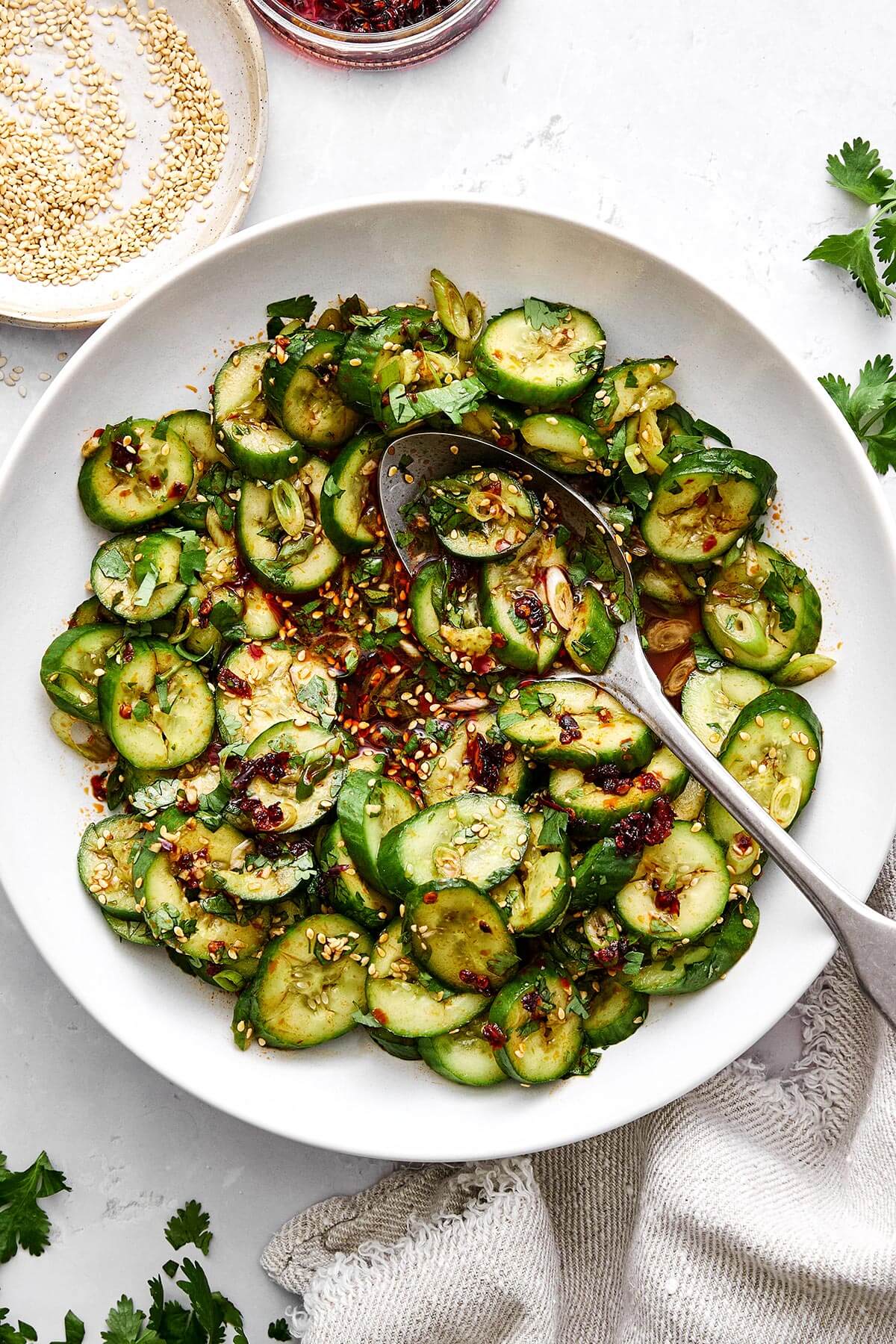 Fresh, crunchy, and packed with flavor, this Asian cucumber salad is the perfect side dish for Asian-inspired dinners! Asian cucumber salad recipe.
