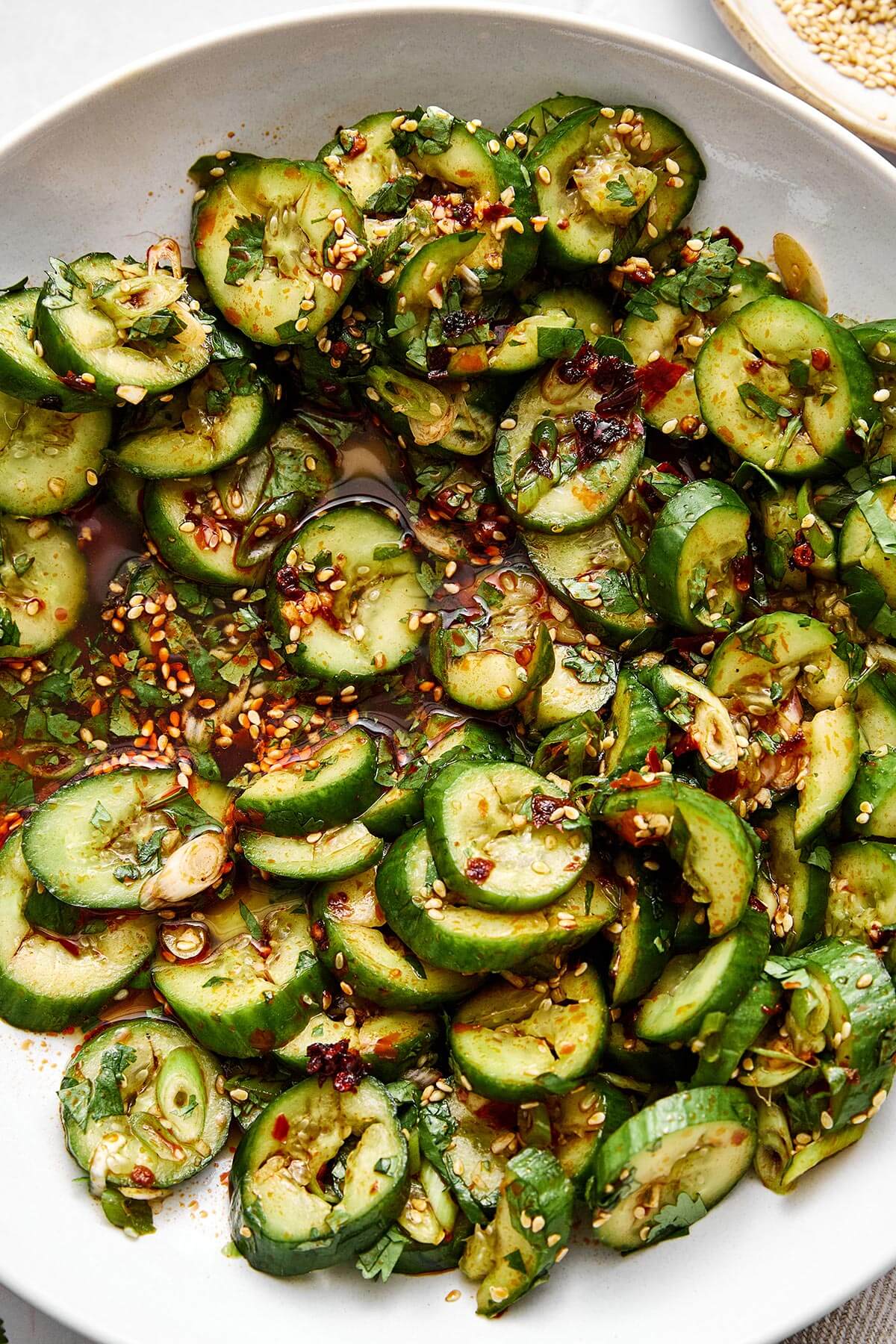 Fresh, crunchy, and packed with flavor, this Asian cucumber salad is the perfect side dish for Asian-inspired dinners! Asian cucumber salad in a bowl.