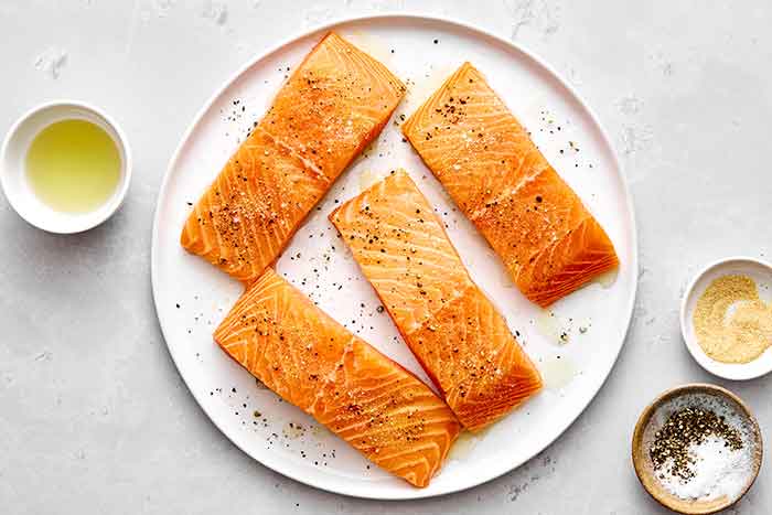 Salmon fillets on a plate.