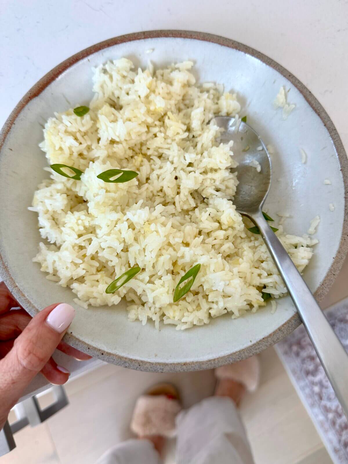 Lisa holding a bowl of ginger rice.