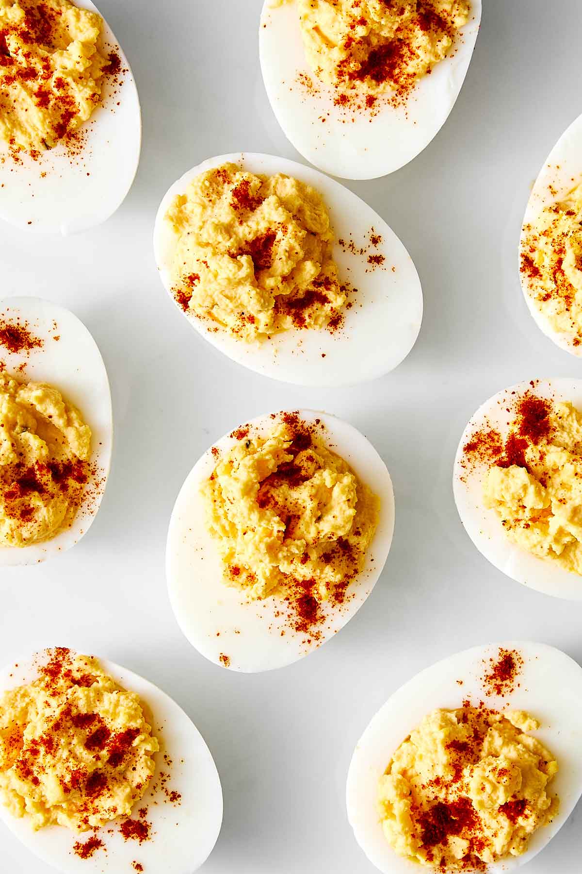 Deviled eggs on a white plate.