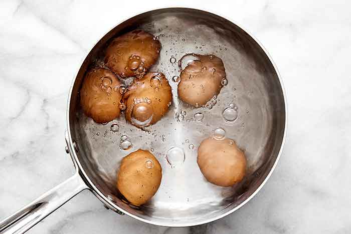 Boiling eggs in a pot.