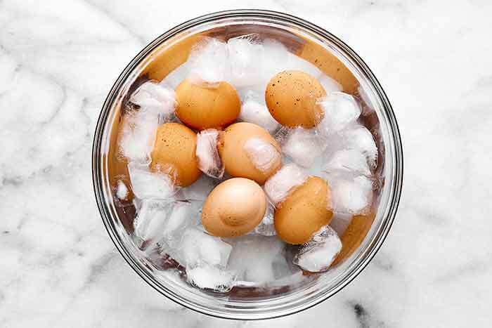 Hard boiled eggs in an ice water bath.