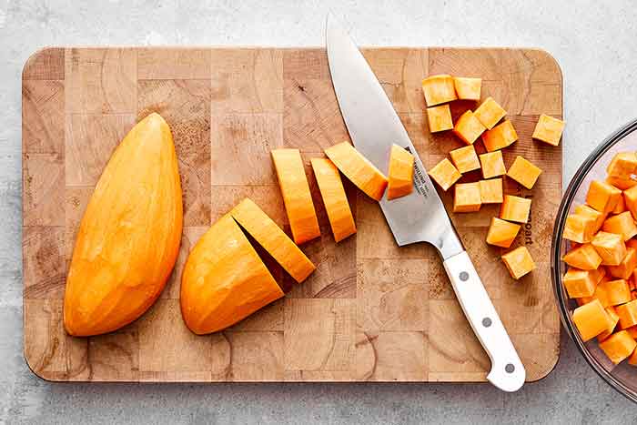 Slicing sweet potatoes for a sweet potato salad.