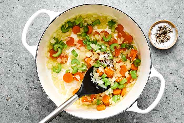 Cooking veggies in a pot for turkey soup.