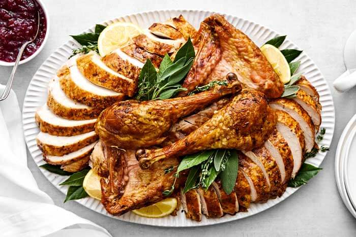 Turkey carved up on a serving platter.