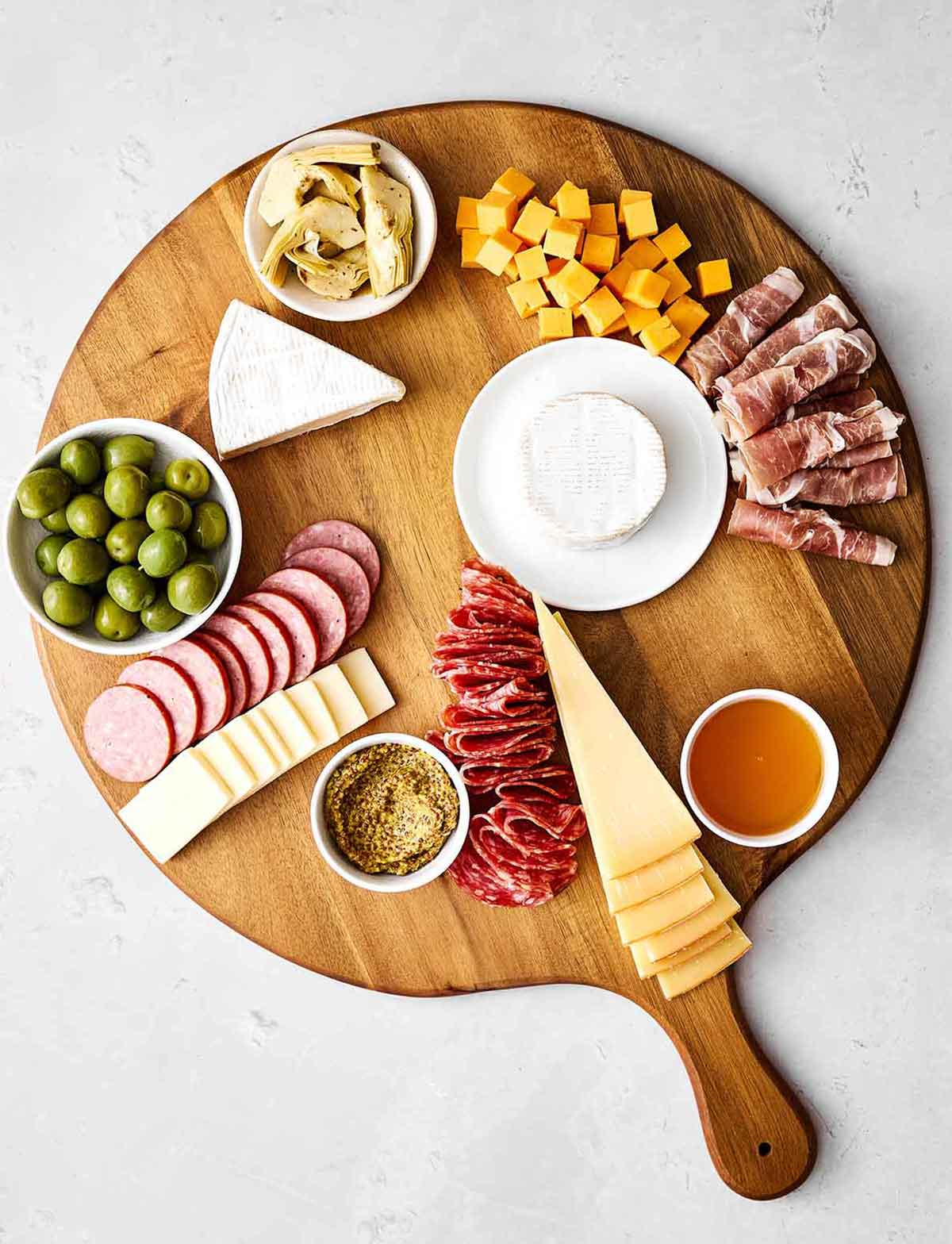 Step three of a charcuterie: Add bowls.
